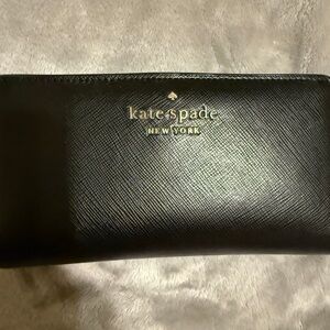 Kate Spade New York Staci Large Slim Bifold Wallet in black saffiano leather